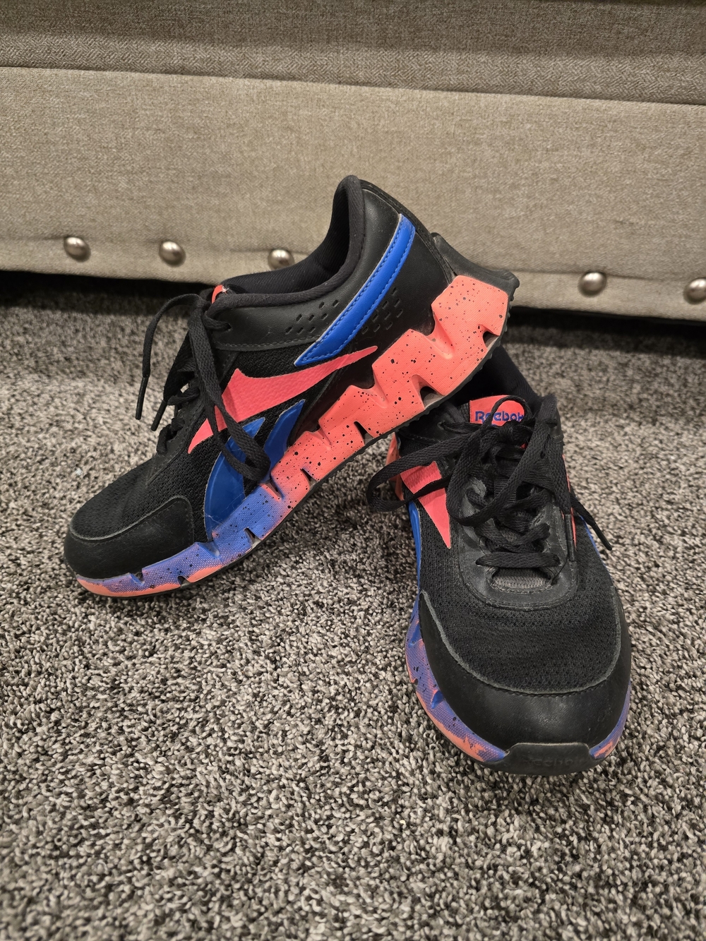 Reebok Black Sneakers with Blue and Muted Red Accents